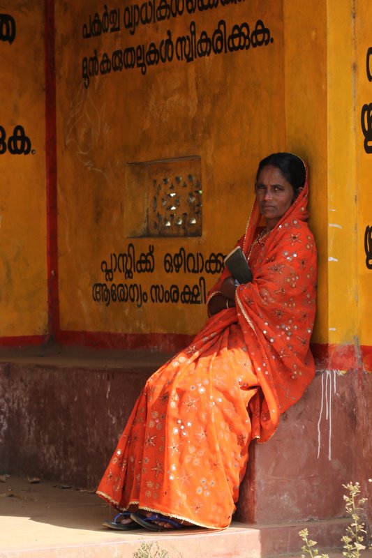 Colourful women at bus-stops